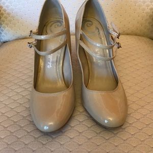 3 inch Nude Mary Jane-style pumps.
